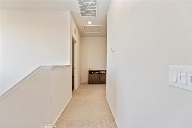 11653 Couples Ct, Beaumont, CA 92223 - hallway featuring attic access, baseboards, and light carpet