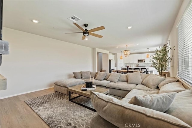 11653 Couples Ct, Beaumont, CA 92223 - living area featuring light wood-type flooring, a ceiling fan, recessed lighting, and baseboards