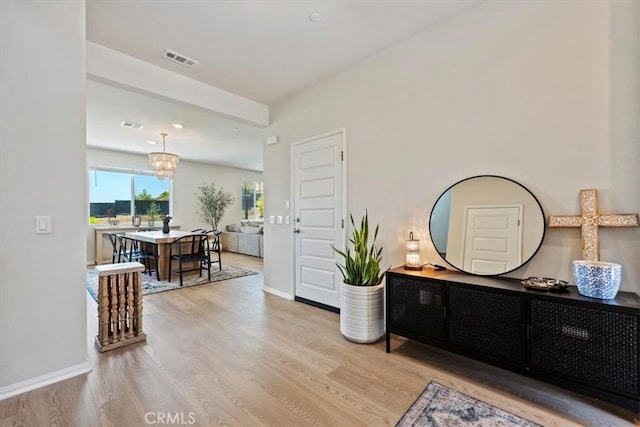 11653 Couples Ct, Beaumont, CA 92223 - hallway featuring a chandelier, wood finished floors, baseboards, and recessed lighting