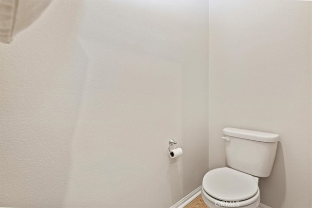11653 Couples Ct, Beaumont, CA 92223 - bathroom with toilet, baseboards, and wood finished floors