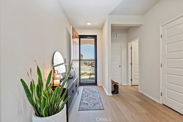 11653 Couples Ct, Beaumont, CA 92223 - foyer entrance with light wood-type flooring and baseboards