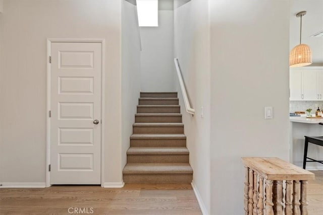 11653 Couples Ct, Beaumont, CA 92223 - stairway featuring wood finished floors and baseboards