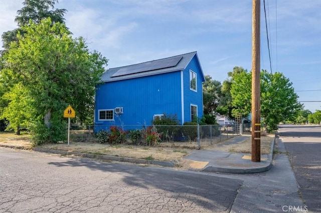 818 6th St, Corning, CA 96021 - view of side of home with roof mounted solar panels