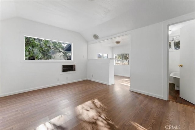 818 6th St, Corning, CA 96021 - unfurnished living room with vaulted ceiling and wood finished floors