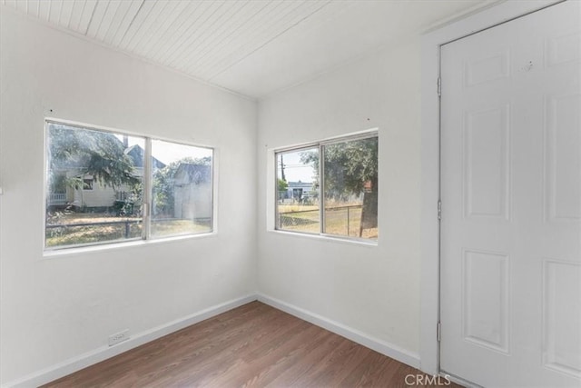 818 6th St, Corning, CA 96021 - spare room with wood finished floors, baseboards, and wood ceiling