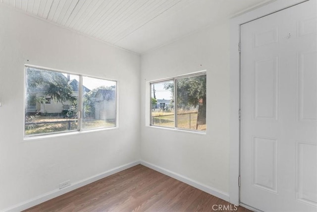818 6th St, Corning, CA 96021 - empty room featuring wood finished floors and wood ceiling