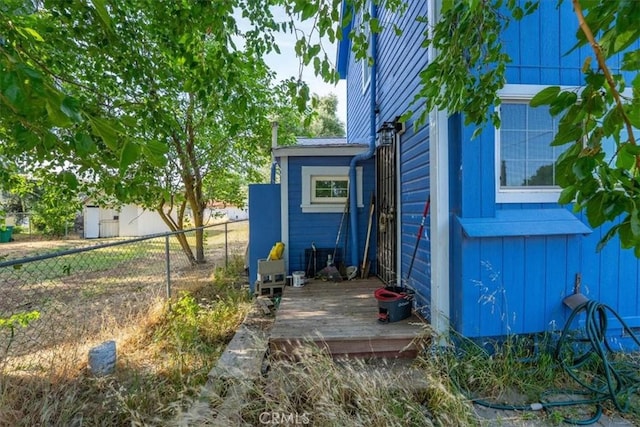 818 6th St, Corning, CA 96021 - view of side of home featuring a deck