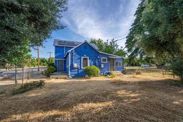 818 6th St, Corning, CA 96021 - view of front facade with roof mounted solar panels