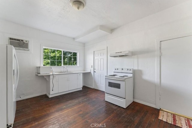 818 6th St, Corning, CA 96021 - kitchen featuring white appliances, dark wood-type flooring, under cabinet range hood, a wall mounted AC, and a sink
