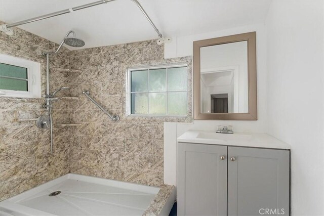 818 6th St, Corning, CA 96021 - full bath featuring plenty of natural light, tiled shower, and vanity