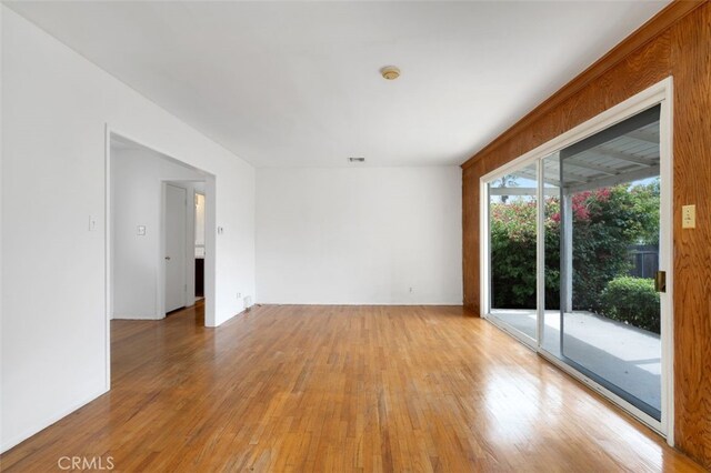 9933 Norwich Ave, Mission Hills San Fernando, CA 91345 - unfurnished room with light wood-type flooring and a smoke detector