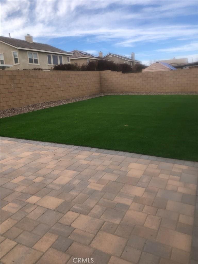 3042 San Luis Dr, Lancaster, CA 93535 - view of yard featuring a patio