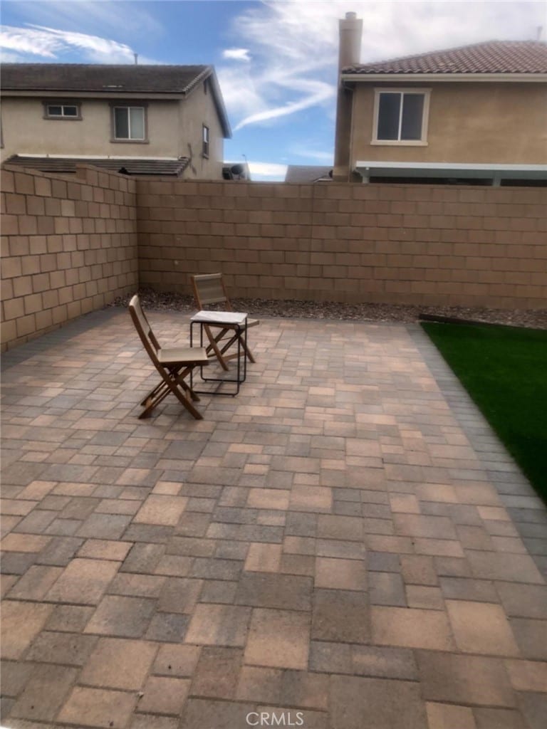 3042 San Luis Dr, Lancaster, CA 93535 - fenced backyard with a patio area
