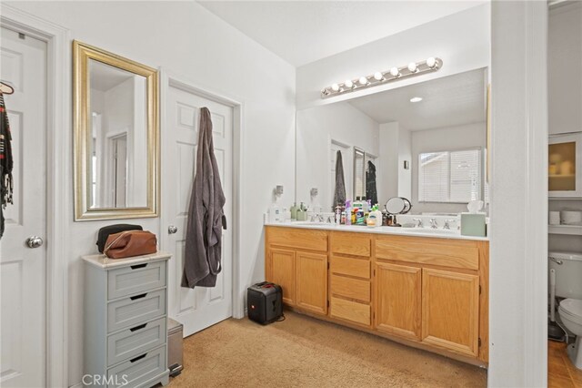 3042 San Luis Dr, Lancaster, CA 93535 - bathroom featuring double vanity and toilet