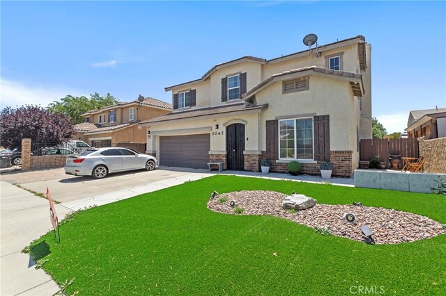 3042 San Luis Dr, Lancaster, CA 93535 - view of front of property featuring stucco siding, concrete driveway, an attached garage, and brick siding
