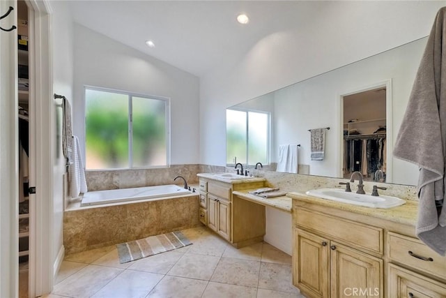 1177 Estee Ct, Fallbrook, CA 92028 - full bathroom featuring double vanity, a spacious closet, a garden tub, tile patterned floors, and lofted ceiling