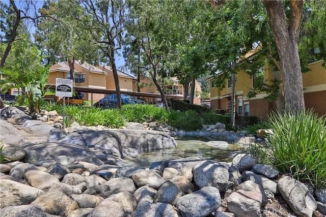 10655 Lemon Ave Unit 2402, Rancho Cucamonga, CA 91737 - view of home's community with a garden pond