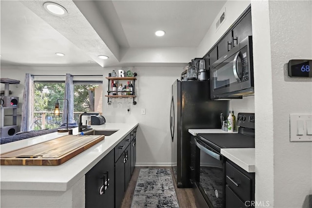 10655 Lemon Ave Unit 2402, Rancho Cucamonga, CA 91737 - kitchen with black appliances, a sink, dark cabinetry, open shelves, and dark wood finished floors