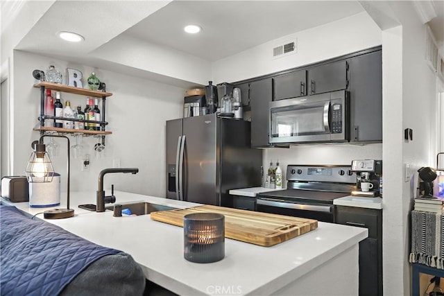 10655 Lemon Ave Unit 2402, Rancho Cucamonga, CA 91737 - kitchen with stainless steel appliances, light countertops, recessed lighting, a sink, and open shelves