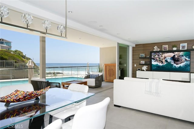 1585 S Coast Unit 2, Laguna Beach, CA 92651 - dining room with a water view, floor to ceiling windows, and tile patterned flooring