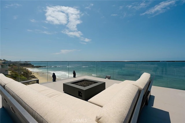 1585 S Coast Unit 2, Laguna Beach, CA 92651 - view of patio with a fire pit, a balcony, and a water view