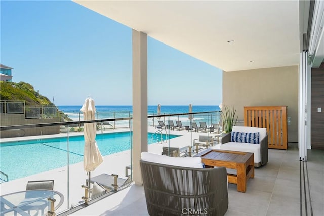 1585 S Coast Unit 2, Laguna Beach, CA 92651 - balcony with view of pool area, a water view, and an outdoor living space