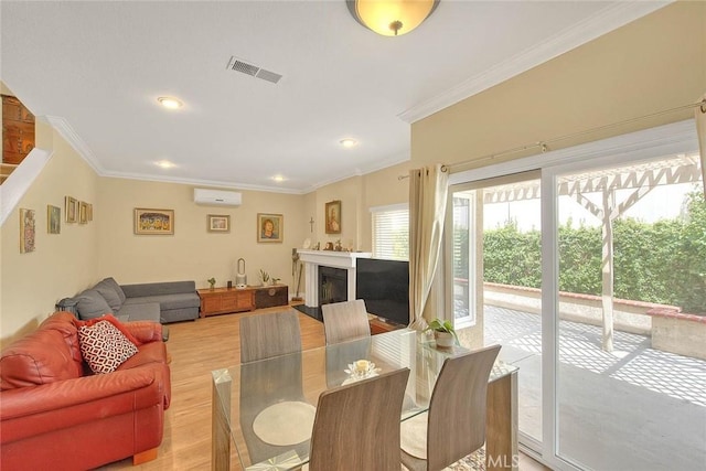 10644 Claridge Pl, Whittier, CA 90603 - living area featuring a wall unit AC, ornamental molding, light wood finished floors, recessed lighting, and a fireplace