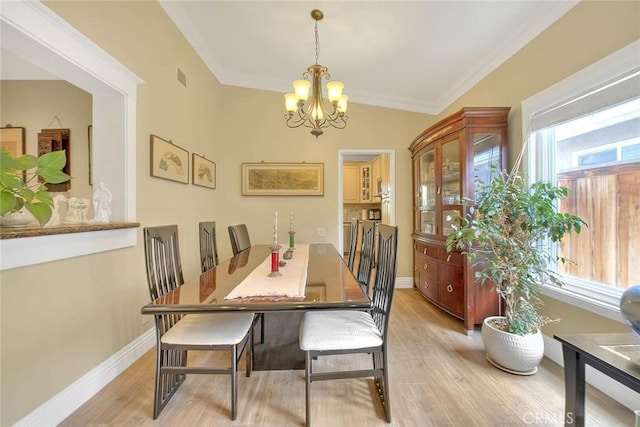 10644 Claridge Pl, Whittier, CA 90603 - dining area with a chandelier, light wood finished floors, ornamental molding, and baseboards