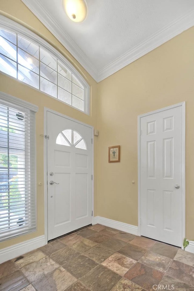 10644 Claridge Pl, Whittier, CA 90603 - entrance foyer with baseboards, stone tile floors, crown molding, and plenty of natural light