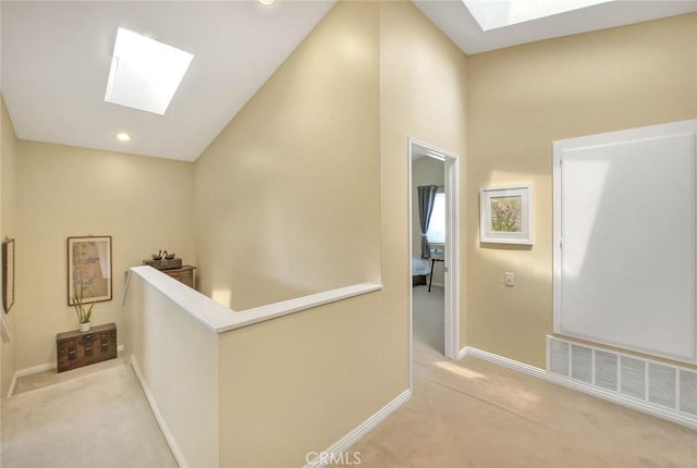 10644 Claridge Pl, Whittier, CA 90603 - corridor with a skylight, light carpet, baseboards, and recessed lighting