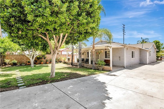 8960 Telfair Ave, Sun Valley, CA 91352 - view of front facade featuring stucco siding, covered porch, and driveway
