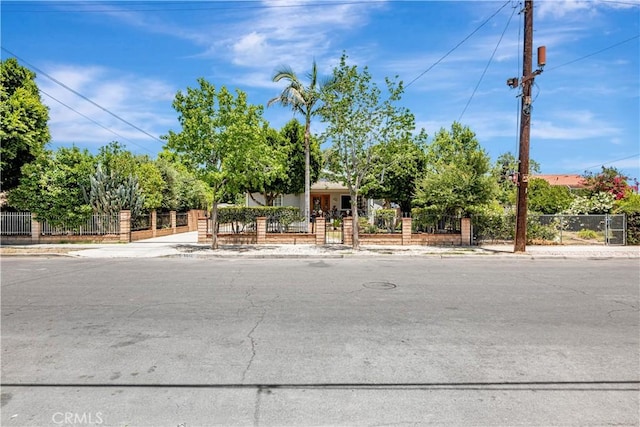 8960 Telfair Ave, Sun Valley, CA 91352 - view of property hidden behind natural elements featuring a fenced front yard and a gate
