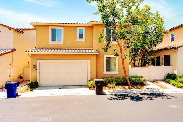 5764 Alcala Way, Riverside, CA 92505 - view of front of property with a tiled roof, an attached garage, stucco siding, and driveway