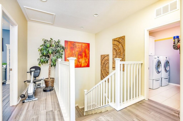 5764 Alcala Way, Riverside, CA 92505 - hall with an upstairs landing, independent washer and dryer, light wood-style flooring, attic access, and recessed lighting