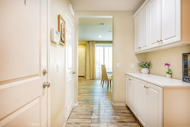 5764 Alcala Way, Riverside, CA 92505 - hall with light wood-type flooring and baseboards