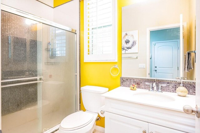 5764 Alcala Way, Riverside, CA 92505 - bathroom with toilet, vanity, and a shower stall