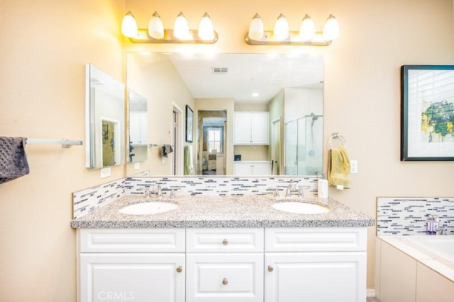 5764 Alcala Way, Riverside, CA 92505 - full bath with a stall shower, double vanity, a garden tub, and tasteful backsplash