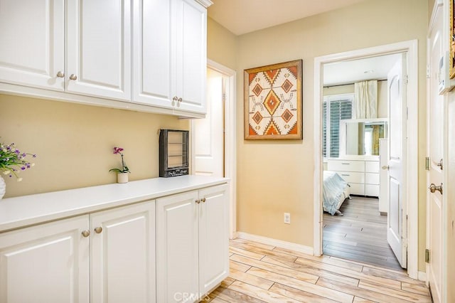 5764 Alcala Way, Riverside, CA 92505 - corridor with light wood-style floors and baseboards