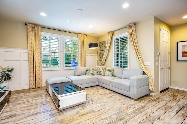 5764 Alcala Way, Riverside, CA 92505 - living area featuring wood finished floors, a decorative wall, recessed lighting, and wainscoting