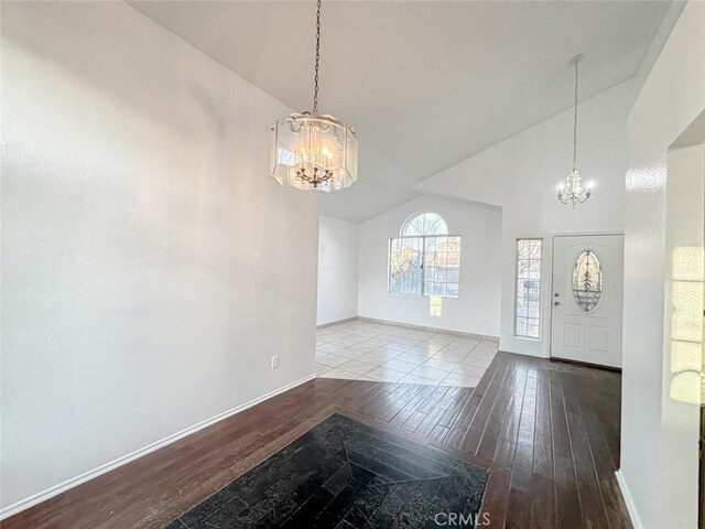 37627 Citrus Dr, Palmdale, CA 93550 - entrance foyer with a chandelier, hardwood / wood-style floors, high vaulted ceiling, and baseboards