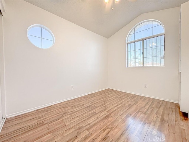37627 Citrus Dr, Palmdale, CA 93550 - spare room featuring wood finished floors, lofted ceiling, and baseboards