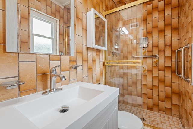 2862 Coronado Ave, San Diego, CA 92154 - full bathroom featuring a shower stall, toilet, vanity, and tile walls