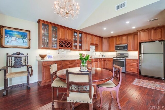 1129 La Casa, San Marcos, CA 92078 - dining room with dark wood-style flooring, a chandelier, lofted ceiling, and recessed lighting
