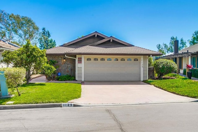 1129 La Casa, San Marcos, CA 92078 - ranch-style house featuring a front yard, concrete driveway, an attached garage, and stone siding