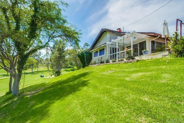 1129 La Casa, San Marcos, CA 92078 - back of house with a sunroom and a yard