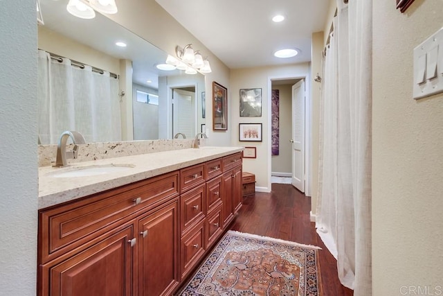 1129 La Casa, San Marcos, CA 92078 - bathroom with double vanity, wood finished floors, and recessed lighting