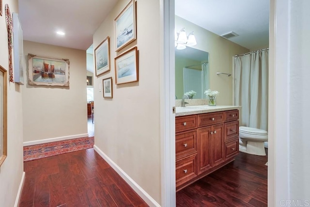 1129 La Casa, San Marcos, CA 92078 - hall featuring dark wood-style floors and recessed lighting