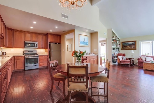 1129 La Casa, San Marcos, CA 92078 - dining room with dark wood-style flooring, a chandelier, high vaulted ceiling, and recessed lighting