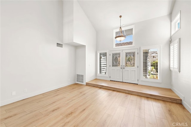 25311 Misty Rdg, Mission Viejo, CA 92692 - entryway featuring high vaulted ceiling, baseboards, wood finished floors, and plenty of natural light