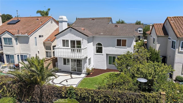25311 Misty Rdg, Mission Viejo, CA 92692 - rear view of property with a balcony, stucco siding, a tile roof, and a chimney